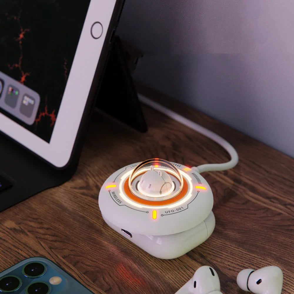 White wireless charger with magnetic MagSafe alignment and charging indicator light on a desk