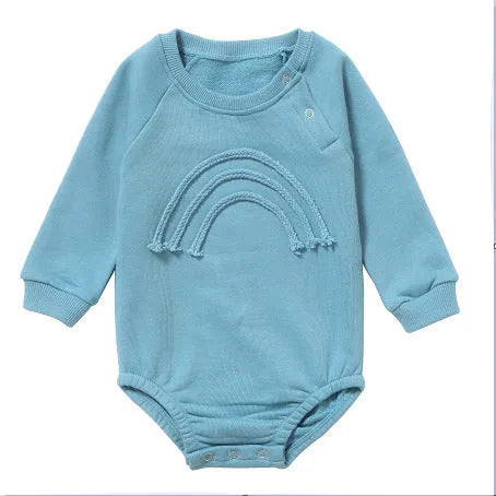 Neutral baby romper in waffle cotton fabric with long sleeves, shown in beige with cotton rope detail.