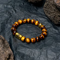 Black and white bodhi seed ethnic bracelet with geometric beads, shown in classic and mini sizes.