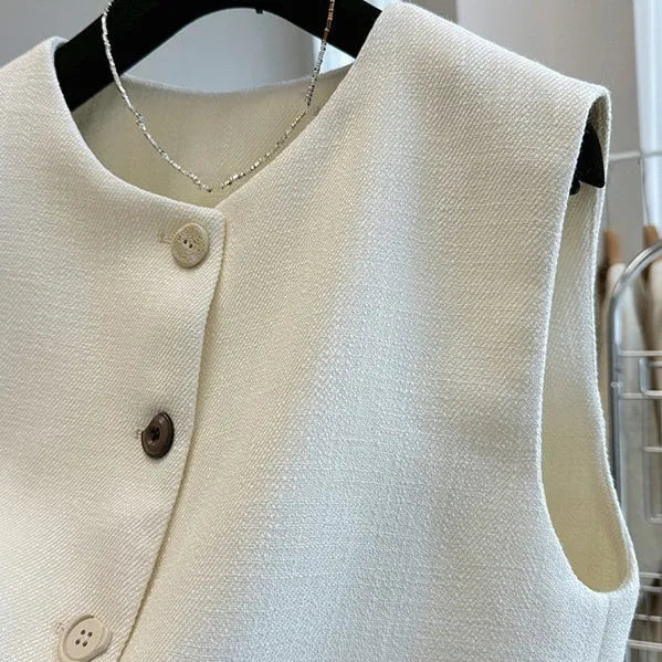 Women's sleeveless round neck vest in French bandage style, polyester fabric in milky white colour