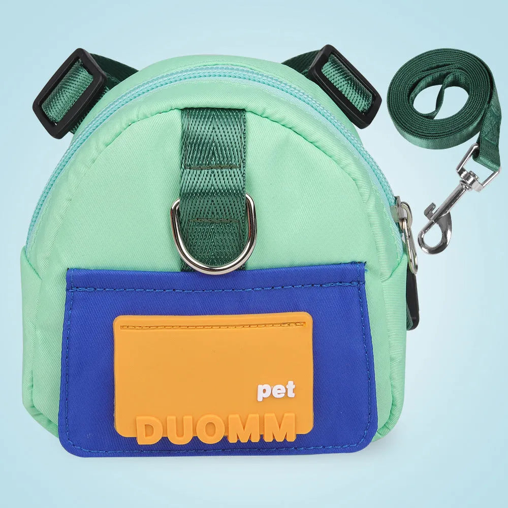 Blue adjustable dog harness backpack with breathable mesh panels and a tow rope attached.
