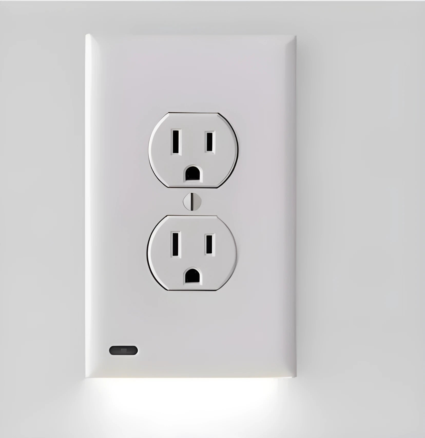 White plug-in socket night light with LED bulbs installed in a wall outlet.