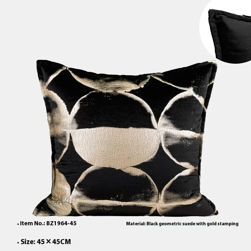 Black gold abstract pattern decorative cushion with removable cover in 45x45cm square size on a grey sofa.