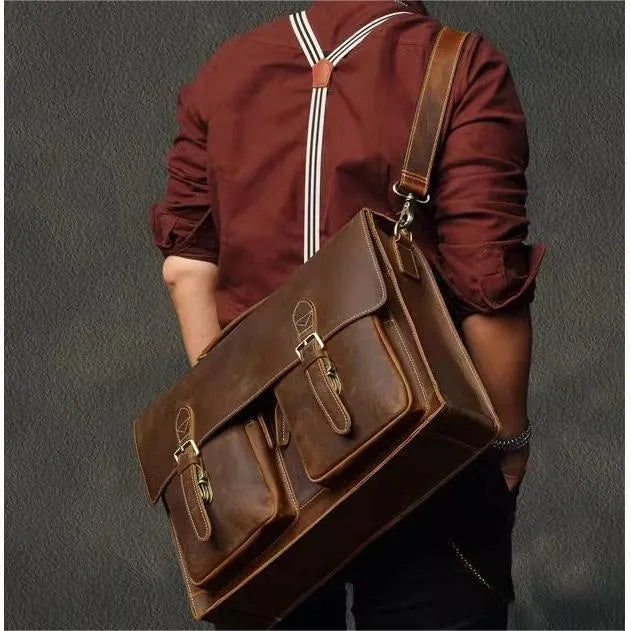 Genuine cowhide leather crossbody computer bag in solid colour with visible sewing lines