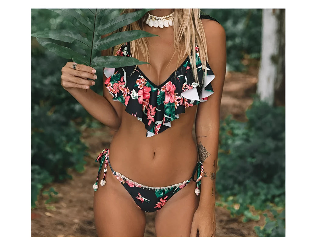 Black bohemian leaf print split bikini swimsuit with chest pad on display