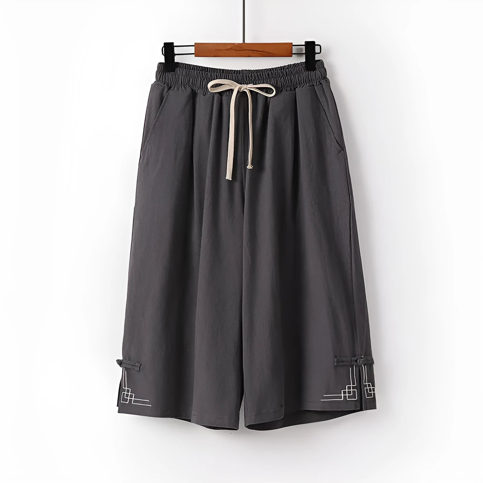 Women's apricot wide leg linen shorts with elastic waist on a hanger