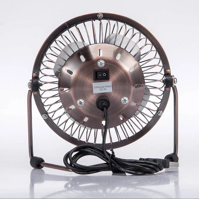 4-inch bronze aluminium USB mini fan with rocker switch on a desk