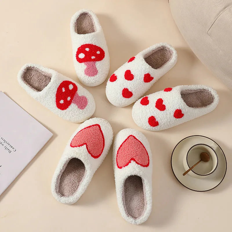 Women's cartoon love style plush slippers in blue smiley colour with round toe and non-slip sole.
