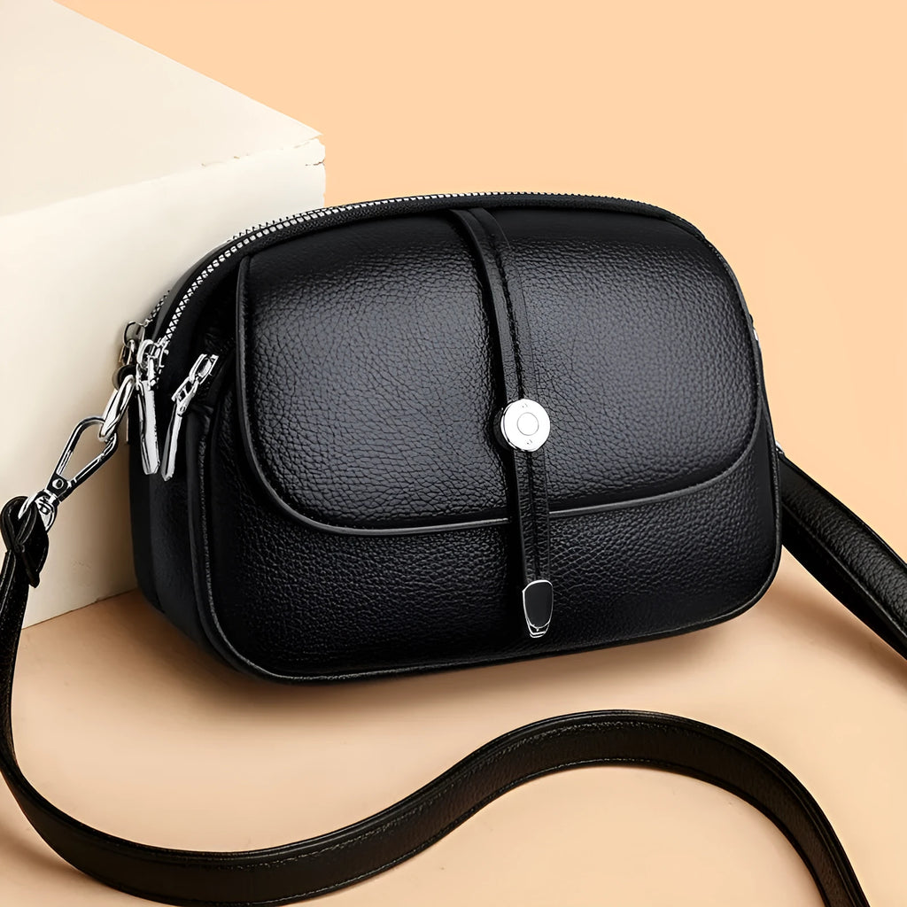 City Simple women's oval crossbody bag in soft PU leather available in black, khaki, or dark brown