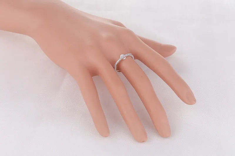 Women's crystal band ring in rose gold finish with cubic zirconia stones, US size 7