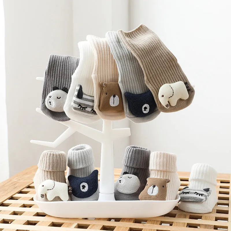 Children's combed cotton non-slip socks in multiple colours for sizes XS, S, and M.