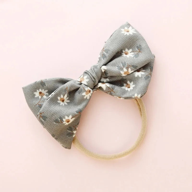 Children's knotted bow hair ring made of cloth in a Princess series Snow White design.