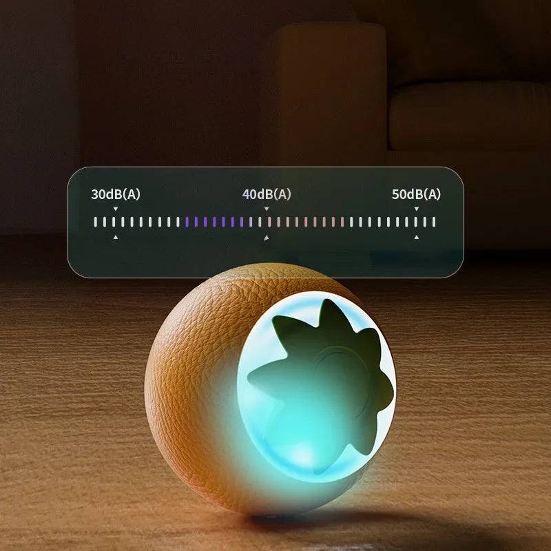 Green rolling ball electric pet toy for dogs and cats on indoor floor surface