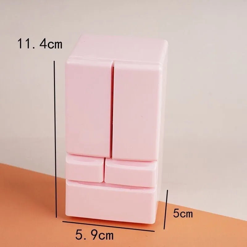 White plastic miniature candy shop model with LED light on, showing detailed front.
