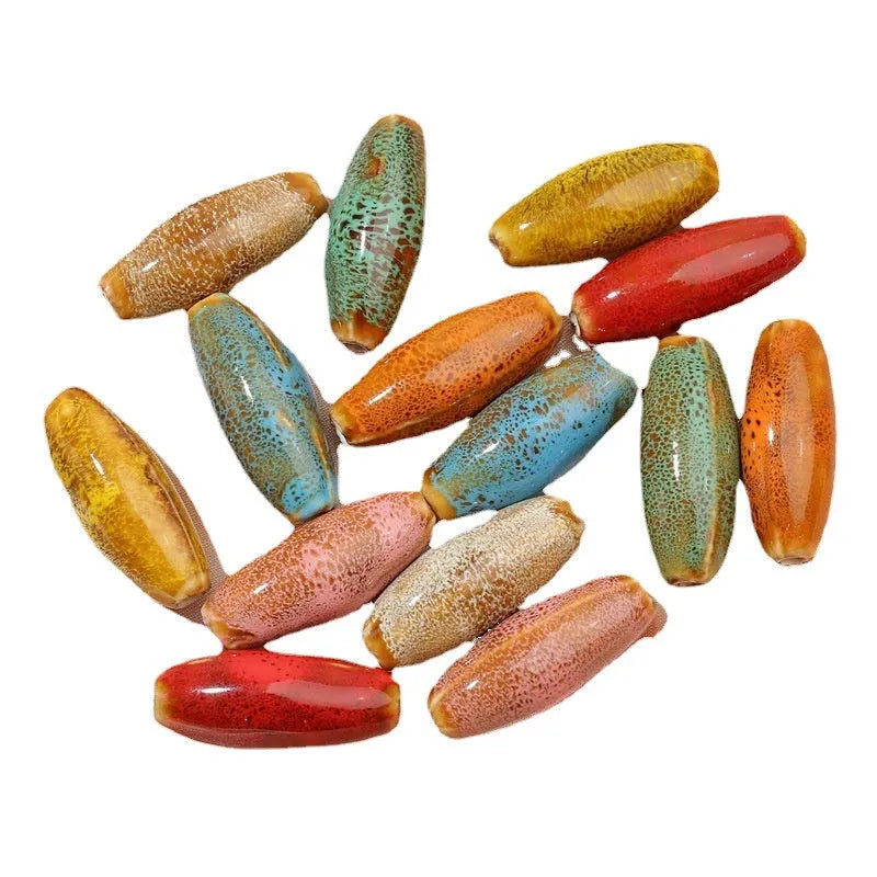 Ceramic bullet beads in various colours for jewellery making and craft projects