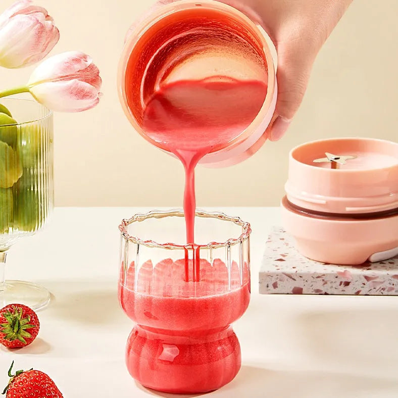 Portable rechargeable blender juicer cup 400ml capacity with four stainless steel blades in purple, green, and orange colour options