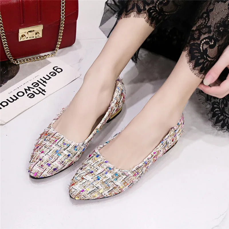 Women's black pointed-toe canvas casual shoes with flat rubber sole