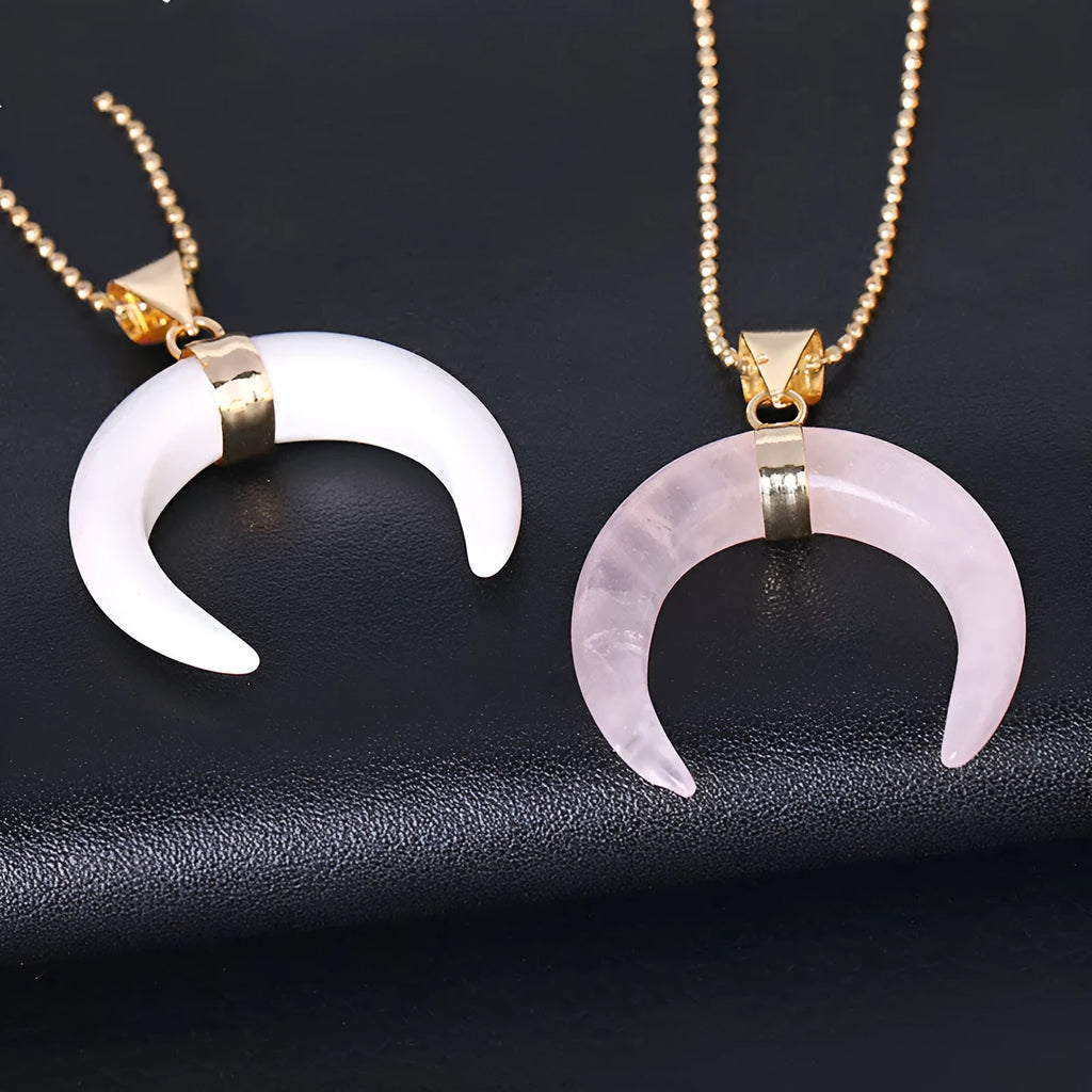 Natural crystal stone moon pendant necklace on an adjustable chain with copper fittings.