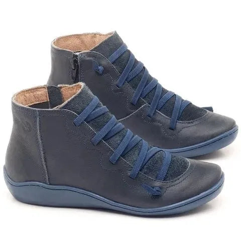 Women's flat casual booties in a round-toe design with a wedge heel, shown in a choice of colours.