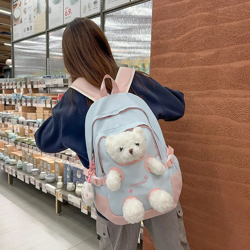 Nylon school backpack in a macaron colour with curved shoulder straps and sewing line detail.