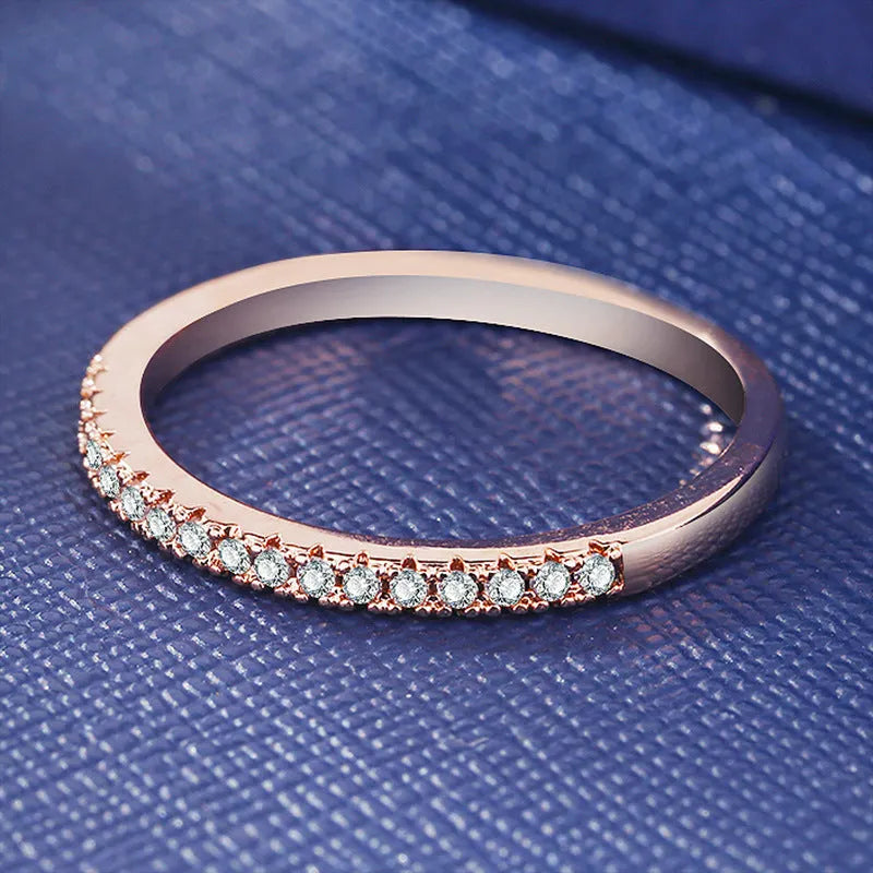 Women's crystal band ring in rose gold finish with cubic zirconia stones, US size 7