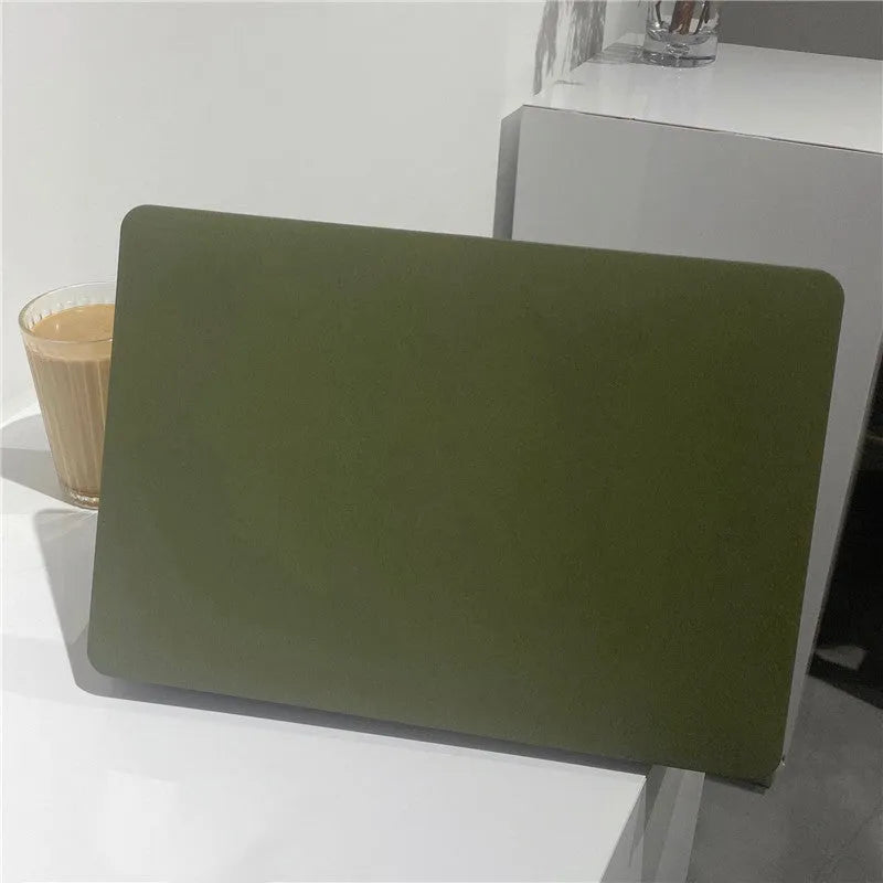 Quicksand army green polycarbonate MacBook protective shell on a laptop showing textured finish.