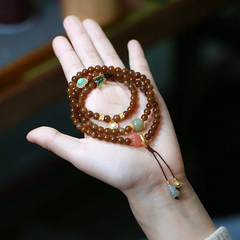 Brown jade Hetian jade women's bracelet with silver accents in a geometric three-ring design.