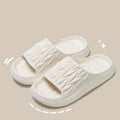 Pair of EVA leaf texture design slippers in multiple colour options on a white background.