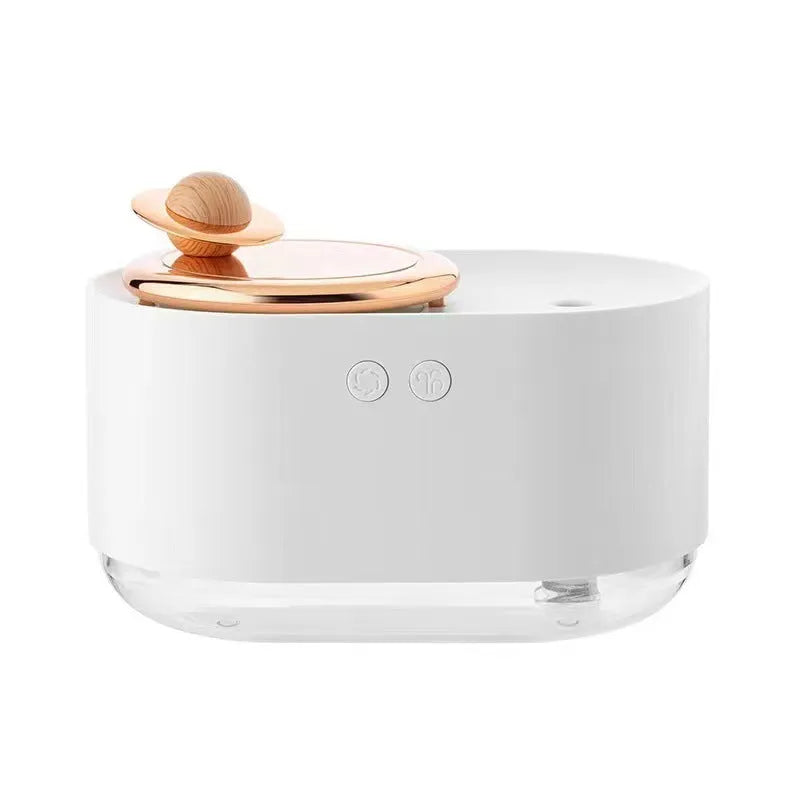 Green rotating planet-shaped USB humidifier with night light on wooden desk