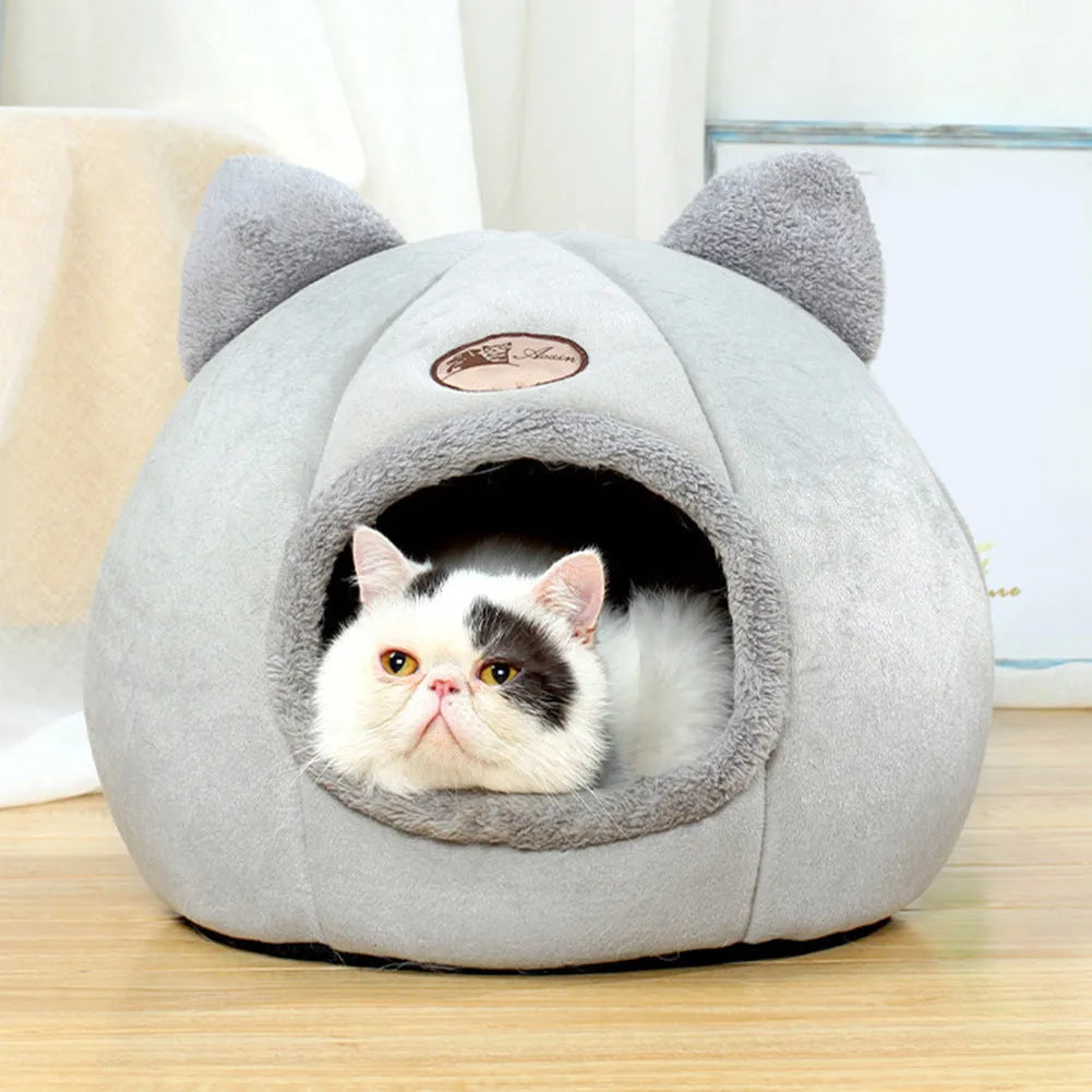 Fully enclosed plush cat winter nest sofa bed with removable cushion, shown in grey