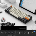 RK61 wireless mechanical keyboard with Bluetooth and USB connectivity on desk with carrying belt