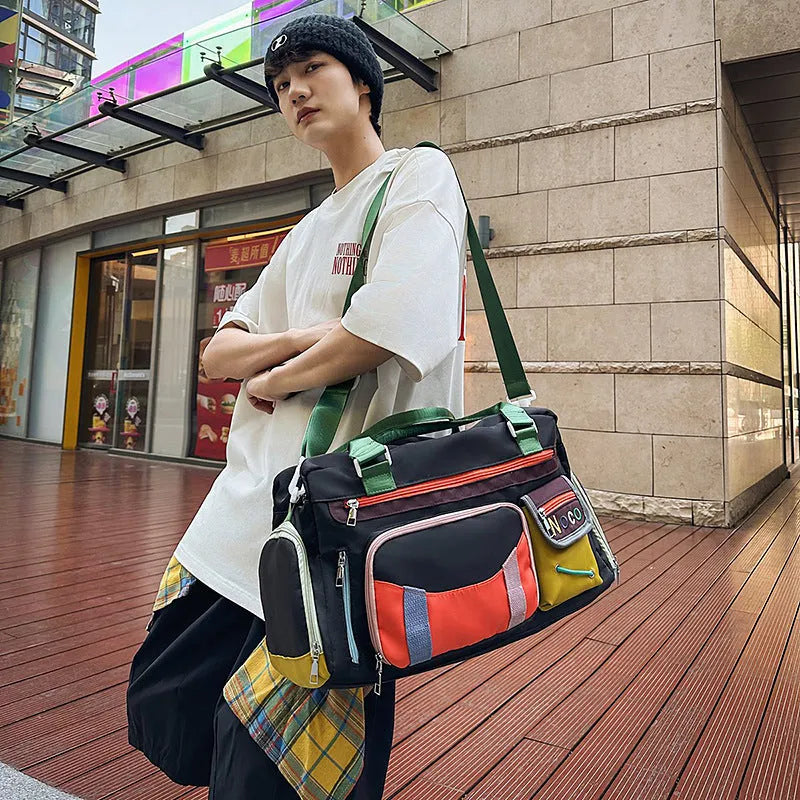 Large capacity Oxford cloth sports shoulder messenger bag in black or khaki with 36-55L storage