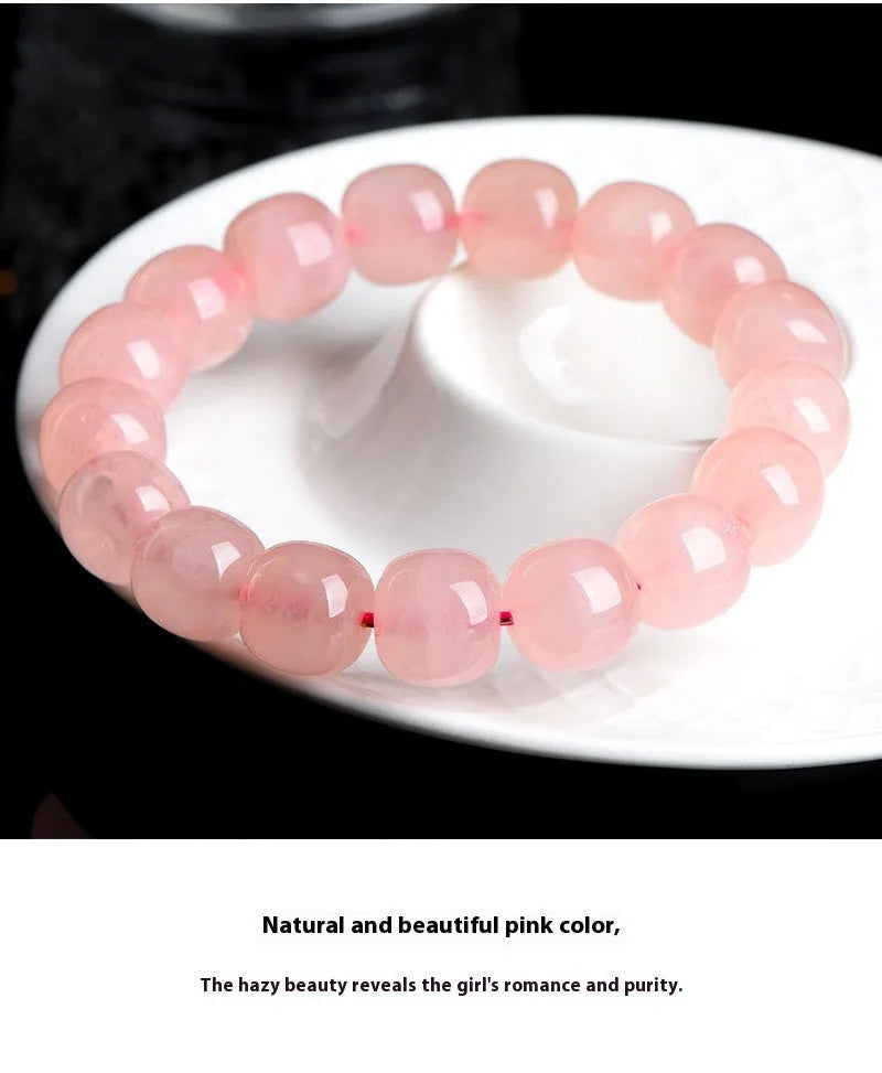 Natural crystal barrel bead bracelet with pink geometry beads measuring 8-10mm