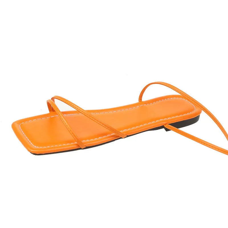 Women's flat sandals with ankle bandage cloth, square toe, and front lace-up in white, black, or orange.