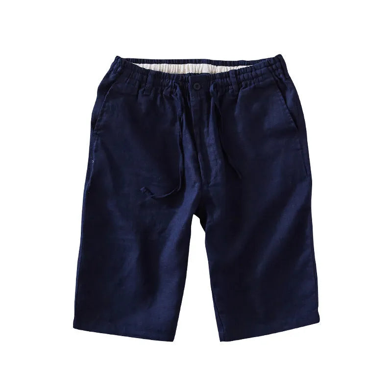 Men's loose-fitting linen capri pants in a light colour, showing the straight-leg style.