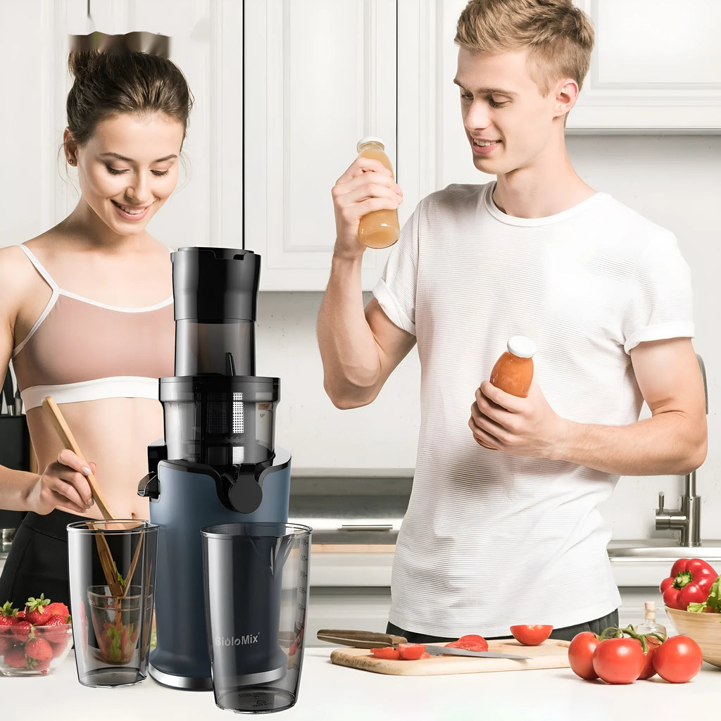 Large diameter low speed juice extractor with plastic body and wide feed chute for whole fruits