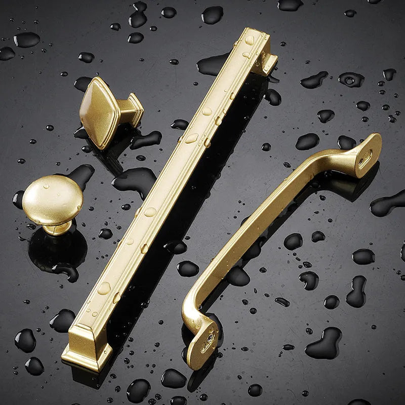 Gold coloured aluminium T-shape single hole cabinet handle and drawer pull