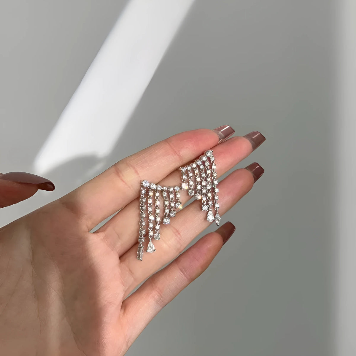 S925 sterling silver stud earrings with round zircon inlay geometric design on white background platinum finish