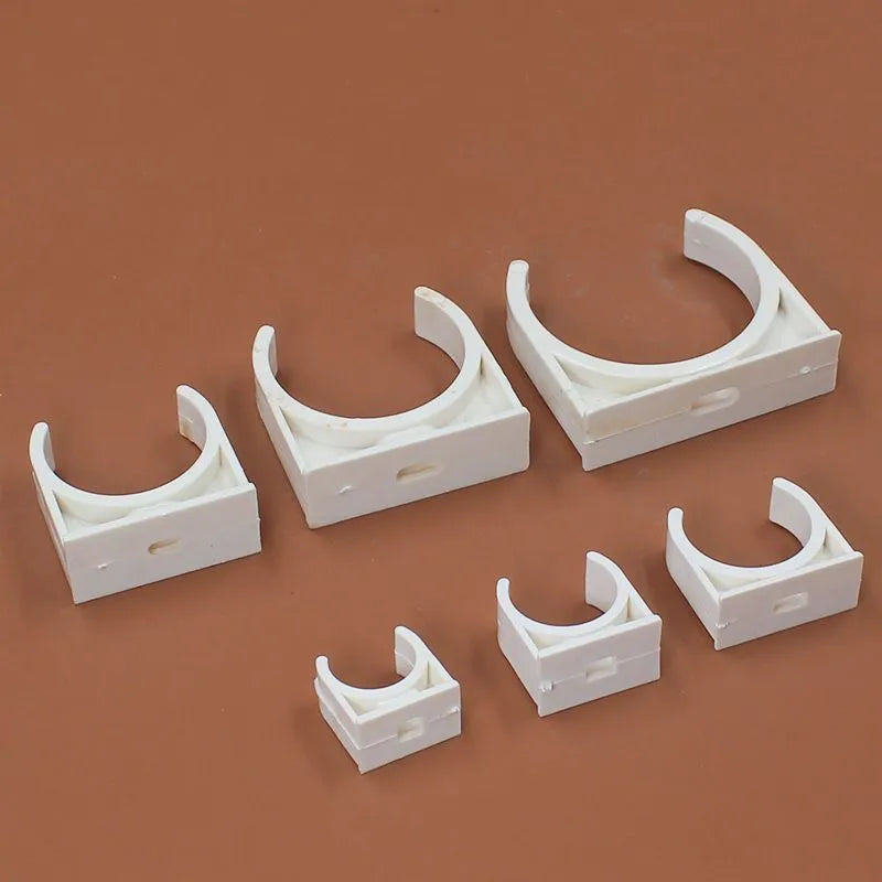 Pack of PVC U-shaped pipe clamps in various sizes for pipe routing