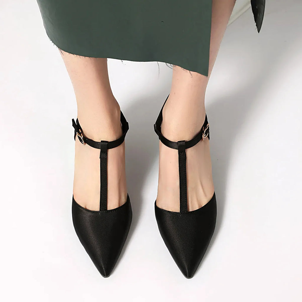 Pointed T-strap high heels in top grain leather, available in black and brown