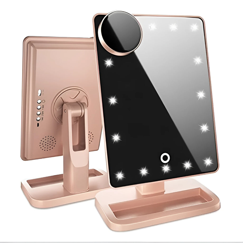 Pink touch screen makeup mirror with ring of 20 LED lights and built-in Bluetooth speaker on a dressing table.