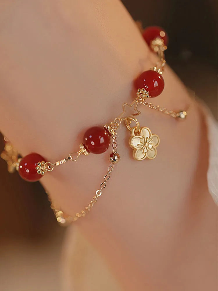 Women's red agate bracelet with double layer design and peach blossom floral elements