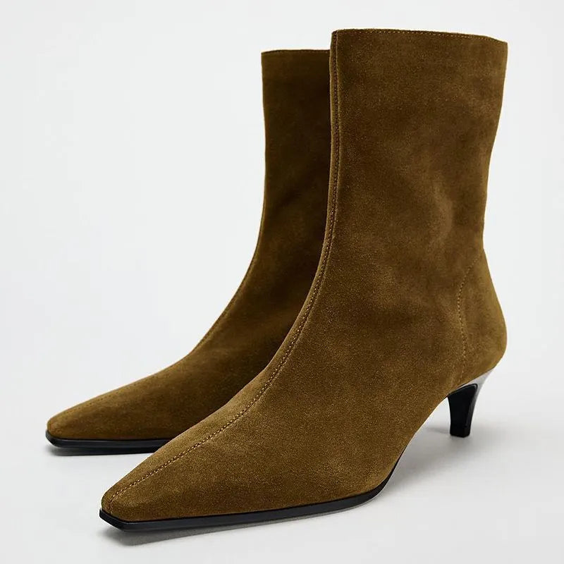 Brown square-toe kitten heel ankle boots with a side zipper on a white background.