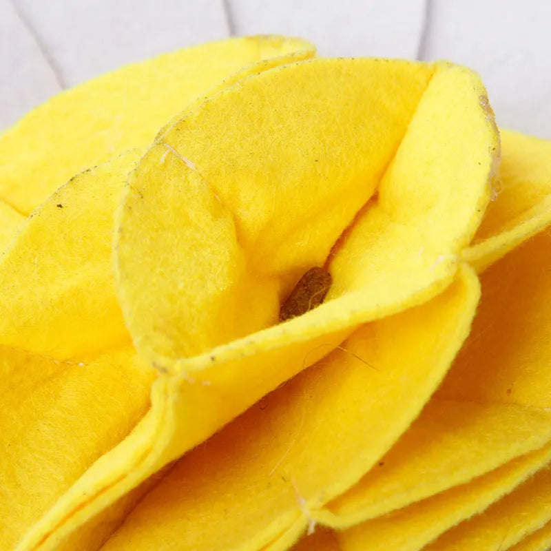 Plush dog sniffing pad toy in photo colour on a soft surface for bite play