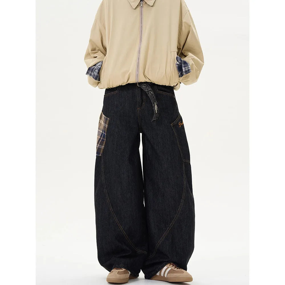 Man wearing loose straight-leg casual trousers in a red plaid pattern.