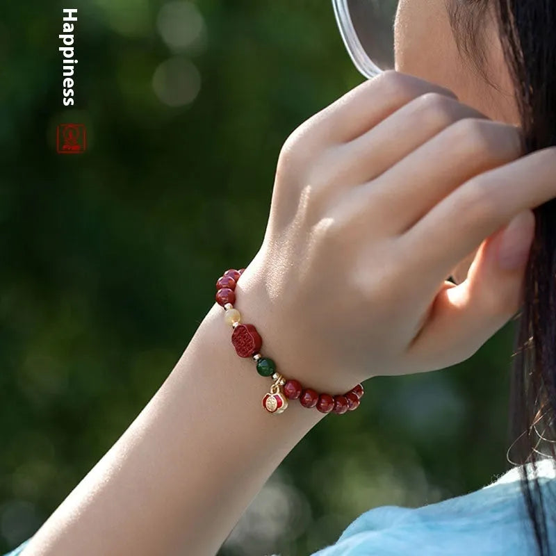 Emperor sandstone cinnabar bracelet with fu charm in 6mm and 8mm bead sizes.