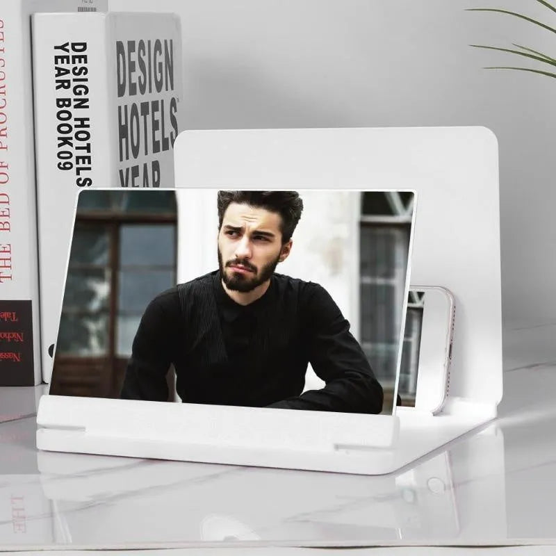 White phone screen amplifier with plexiglass lens showing smartphone magnification