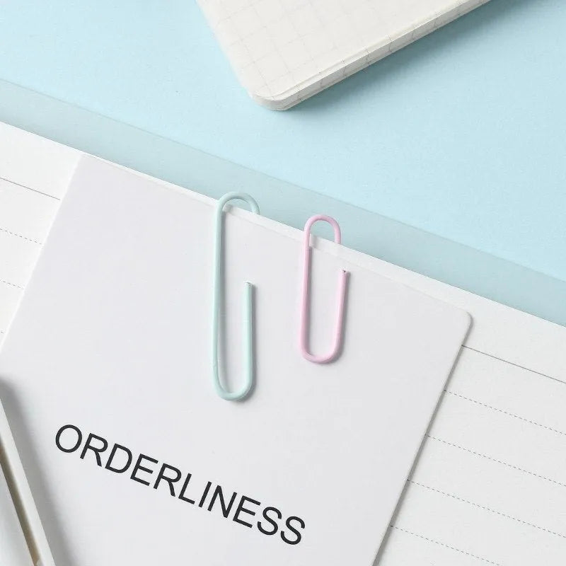 Macaron colour alloy paper clips in pink, purple, and green, 50mm large and 28mm small sizes.