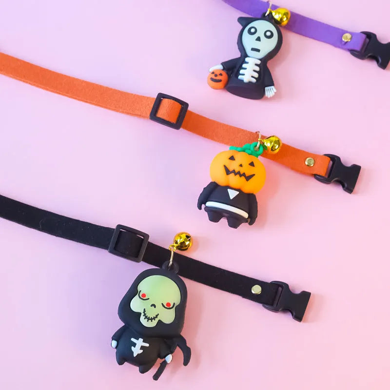 Halloween pet collar with cartoon pumpkin and skull patterns in glow-in-the-dark material, shown in multiple sizes.