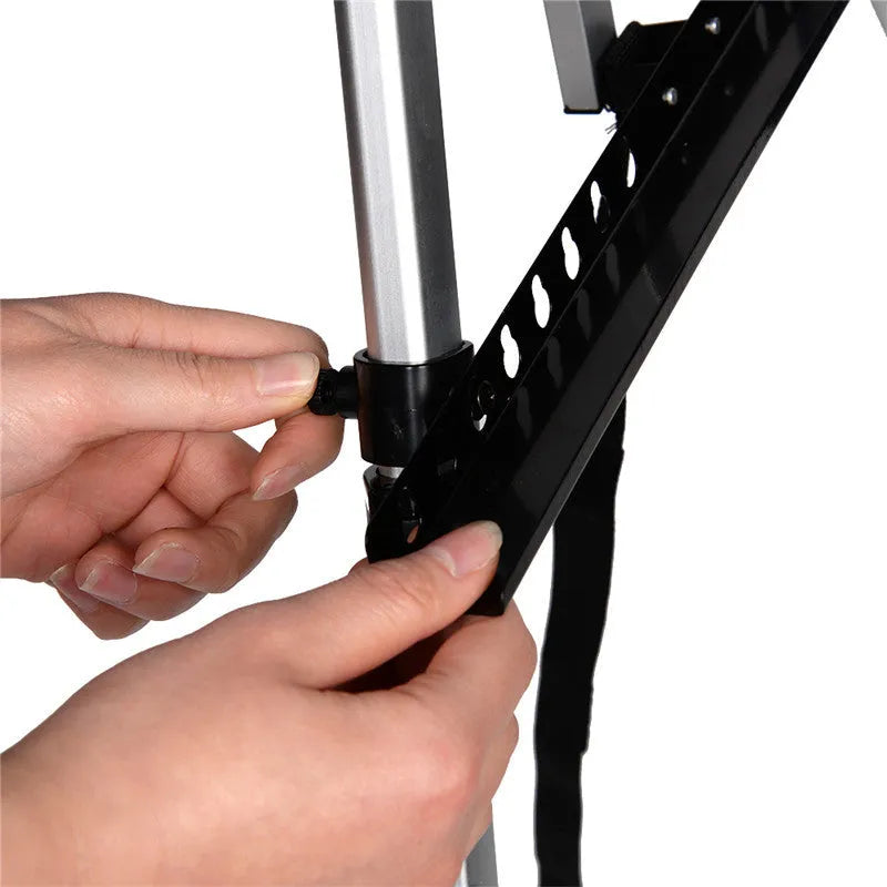 Silver aluminium alloy adjustable easel with metal tray, collapsed for table top use, next to a black nylon carrying bag